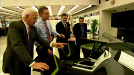 Bob Lutz and Chevy Volt team examining a Volt mock-up