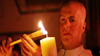 Father Paul O’Brien, Parish Priest at Saint Patrick Parish, Lawrence, MA, lights candle at Easter Vigil