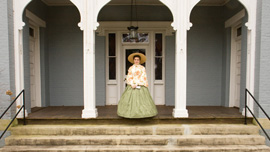 Katie Beach on the front porch of the Columbia Athenaeum