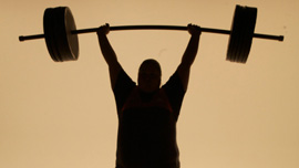 Haworth raises bar overhead ("Jerk")