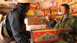 Locho negotiates with a Chinese shopkeeper