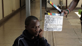 Wayan Mwita, aka “Oli,” shooting a scene in The Team