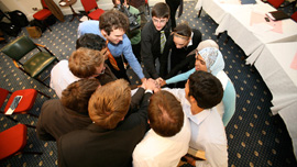 Team Qatar prepare for a debate