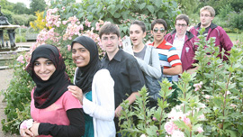 Team Qatar members talk to a protester