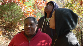 Pearl, Anthony, and Karina walk about Walden Pond 