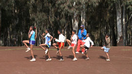 Children in Bekoji standing in line being instructed by Coach Sentayehu Children in Bekoji standing in line being instructed by Coach Sentayehu