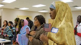 Students recite the Pledge of Allegiance during ESL class. 
