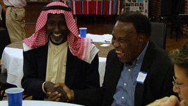 Mohamed Ali shakes hands with Mayor Eugene Ray. 