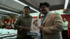 Naif Al-Mutawa holding a comic rendering of himself illustrated by a fan in Jakarta