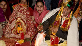 Hari and Suman perform the traditional fire ritual, an integral part of a Hindu wedding.