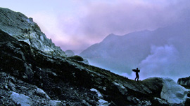 Anto, a young miner who is among 500 sulfur miners working at Kawah Ijen, climbs down into the heart of the volcano.