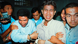 Sok Sam Oeun and Born Samnang are dragged from the courtroom after being convicted of murdering Chea Vichea. Sok Sam Oeun and Born Samnang are dragged from the courtroom after being convicted of murdering Chea Vichea.