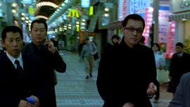 Kumagai-san and two yakuzas shop in Tokyo’s streets. Kumagai-san and two yakuzas shop in Tokyo’s streets.